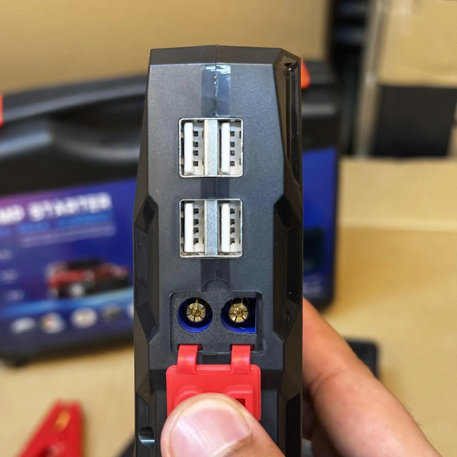 Portable jump starter with multiple USB ports and tire inflator for vehicles