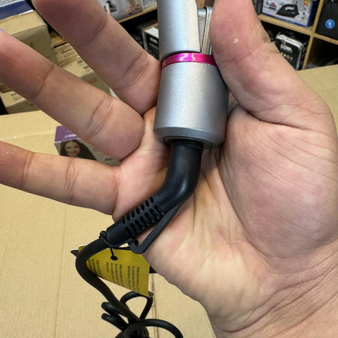 Person’s hand holding Lot Imported Babyverse Professional Hair Straightener with black cord