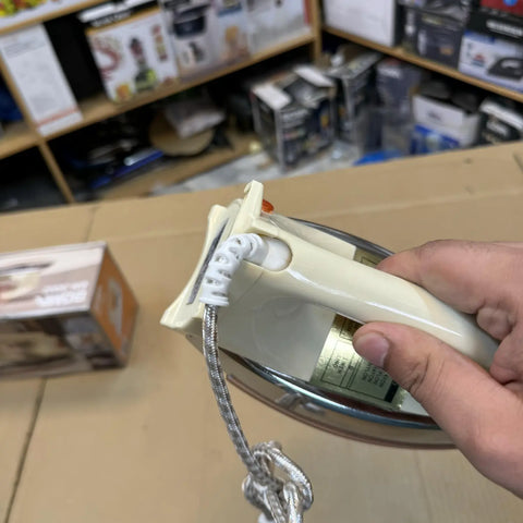 Cream-colored dry iron with silver soleplate and braided cord, German Lot Imported Boma Heavy Dry Iron BM-3002
