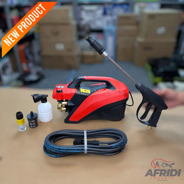 A compact red and black pressure washer with its spray gun, hose, and attachments.