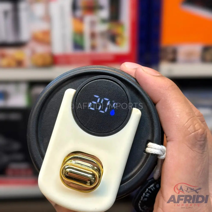 A black smart water bottle with a digital temperature display and a gold-colored infuser.