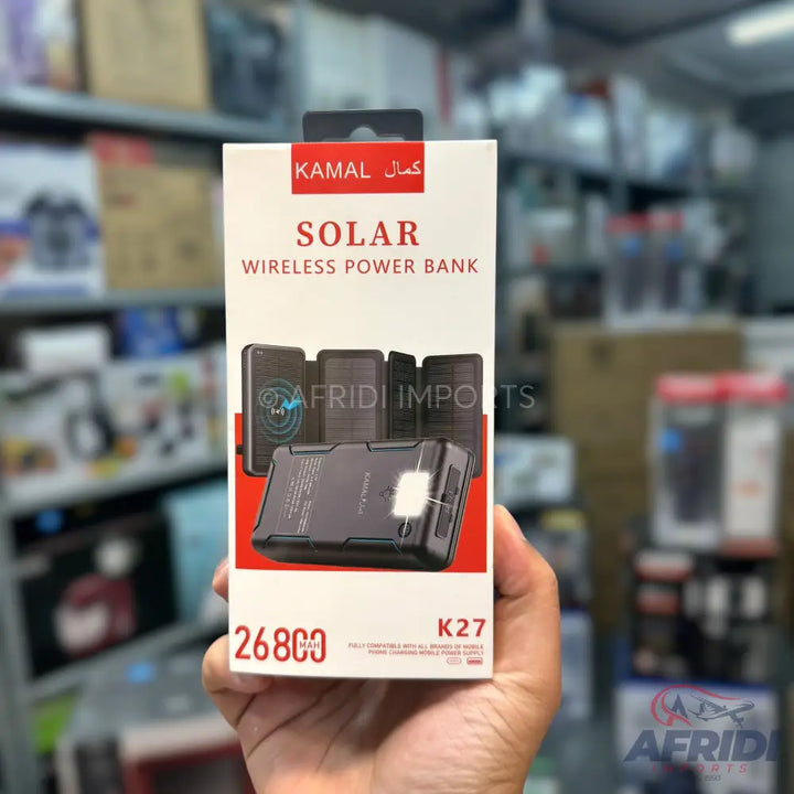 A white box for a black solar wireless power bank, with ’KAMAL SOLAR WIRELESS POWER BANK’ printed at the top and ’26800 K27’’ at the bottom.