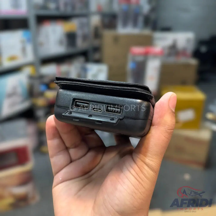 Black power bank with multiple USB ports.