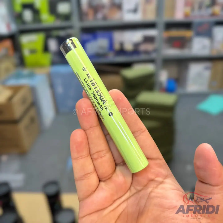 A lime green lithium-ion battery.