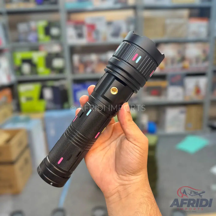 Black tactical flashlight with colorful indicator lines.