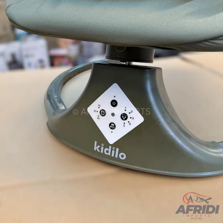 An olive green baby bouncer with a control panel for various settings.