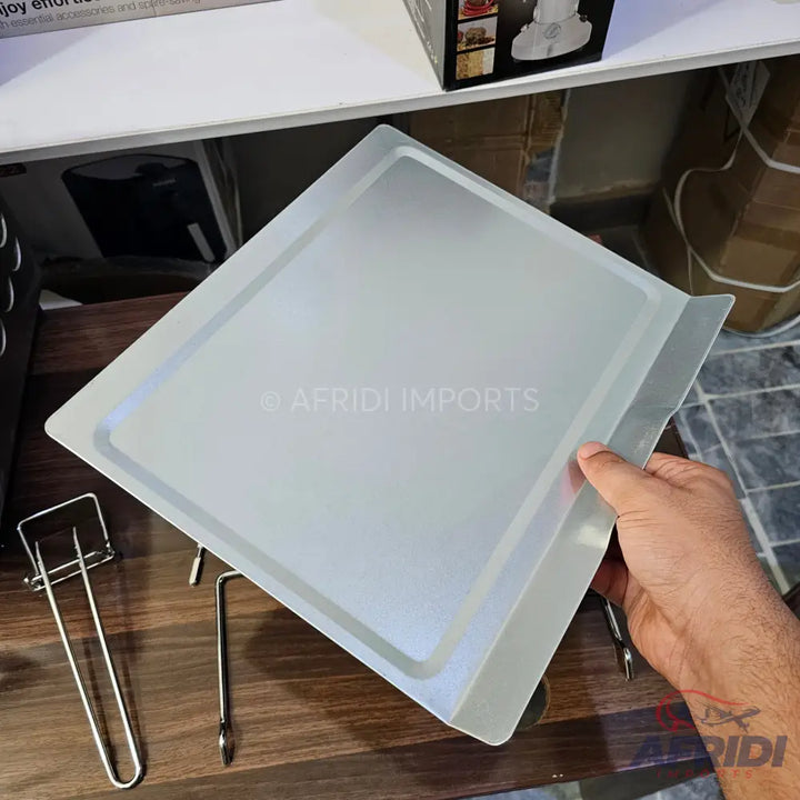 Silver-colored baking tray with raised edges.