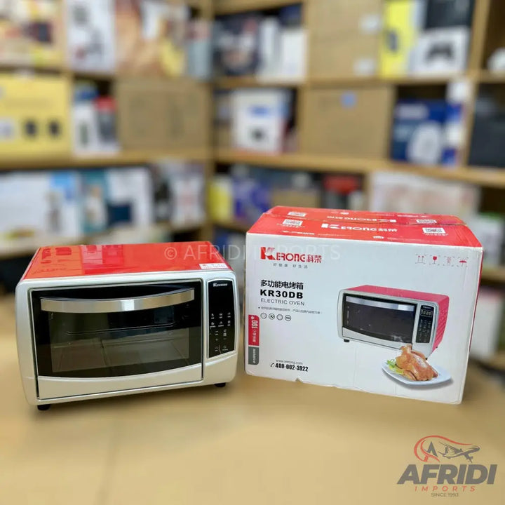 A countertop electric oven with a red top and silver/white body, featuring a transparent door, control knobs, and a handle.