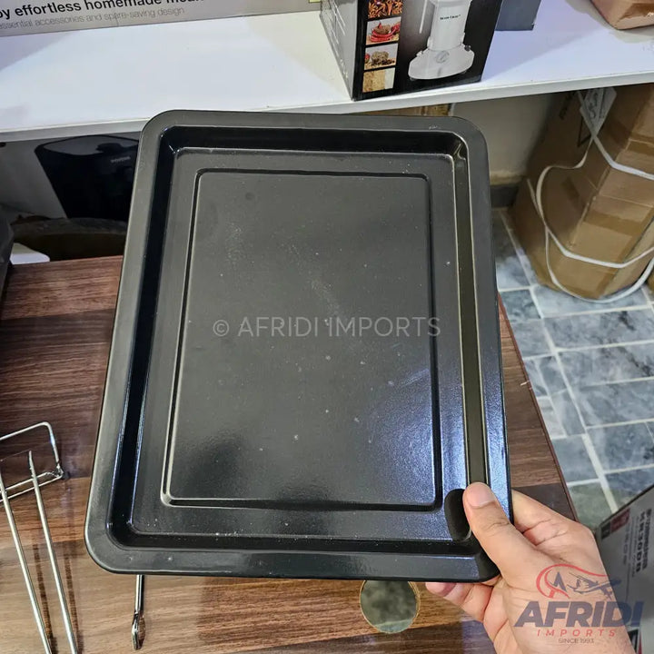 Black, rectangular baking tray with raised edges.