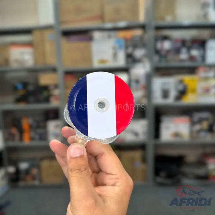 CD-shaped item with French flag design