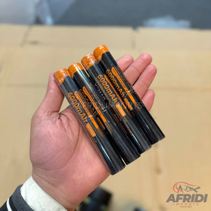 Five black and orange 6000mAh batteries.