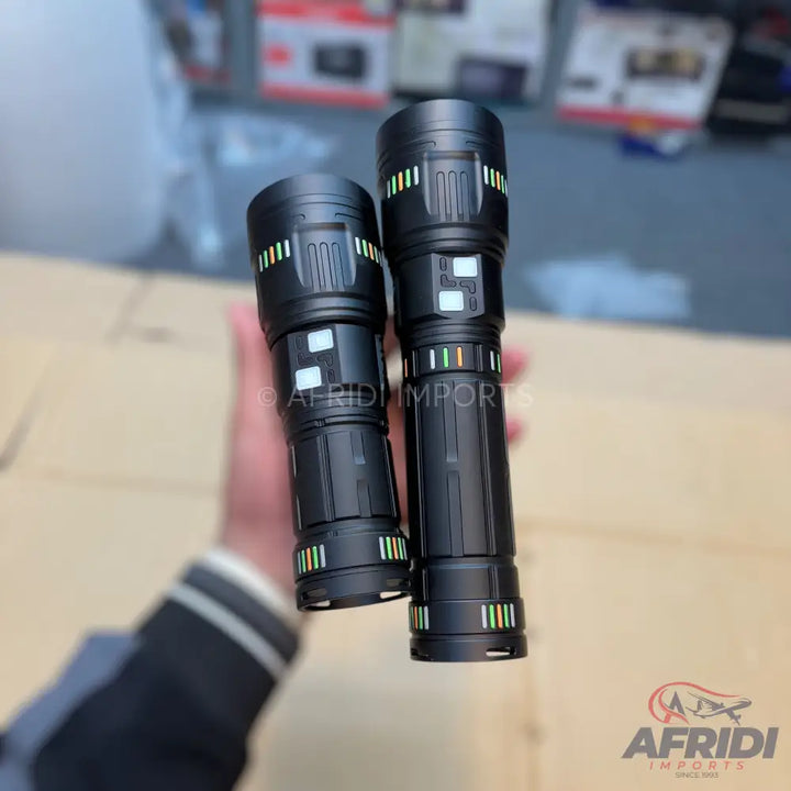Two black tactical flashlights with indicator lights.