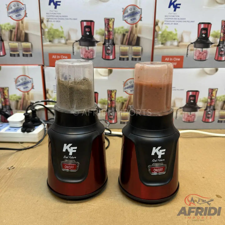 Two red and black blenders, one with ground spices and one with a smoothie.