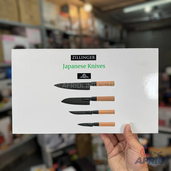 White box containing a set of five Japanese-style kitchen knives with wooden handles.
