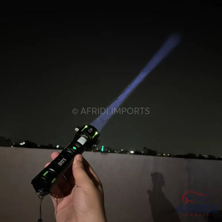 A black tactical flashlight with a bright blue beam.