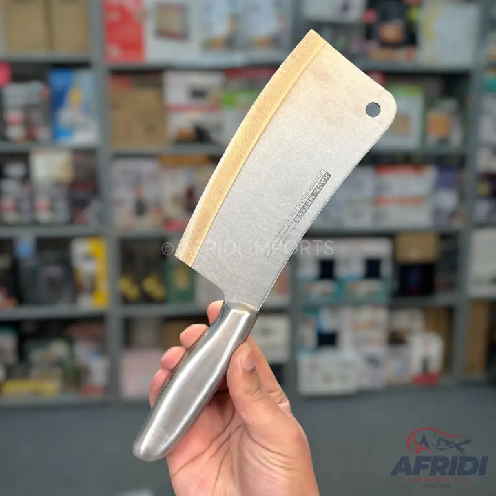 Stainless steel meat cleaver with a silver handle.