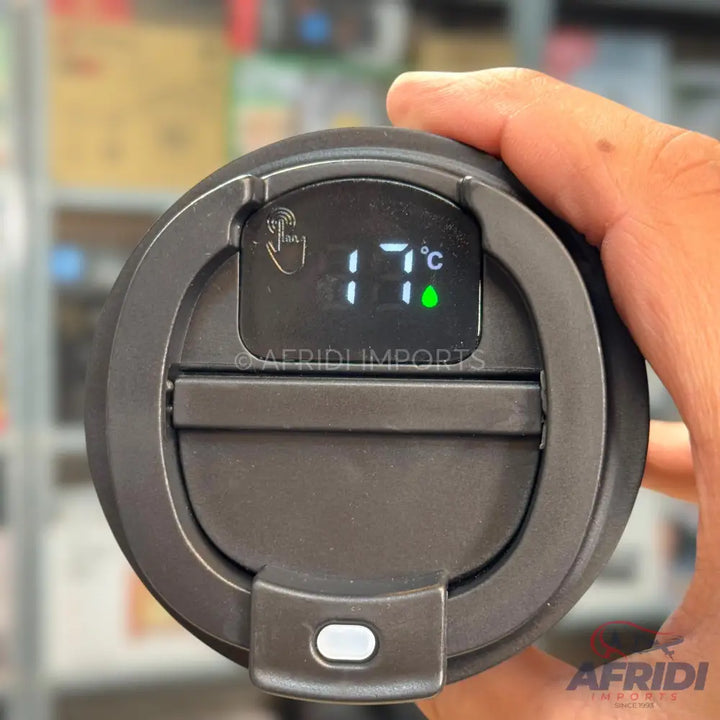 Black smart thermal mug with a digital temperature display showing 17°C.