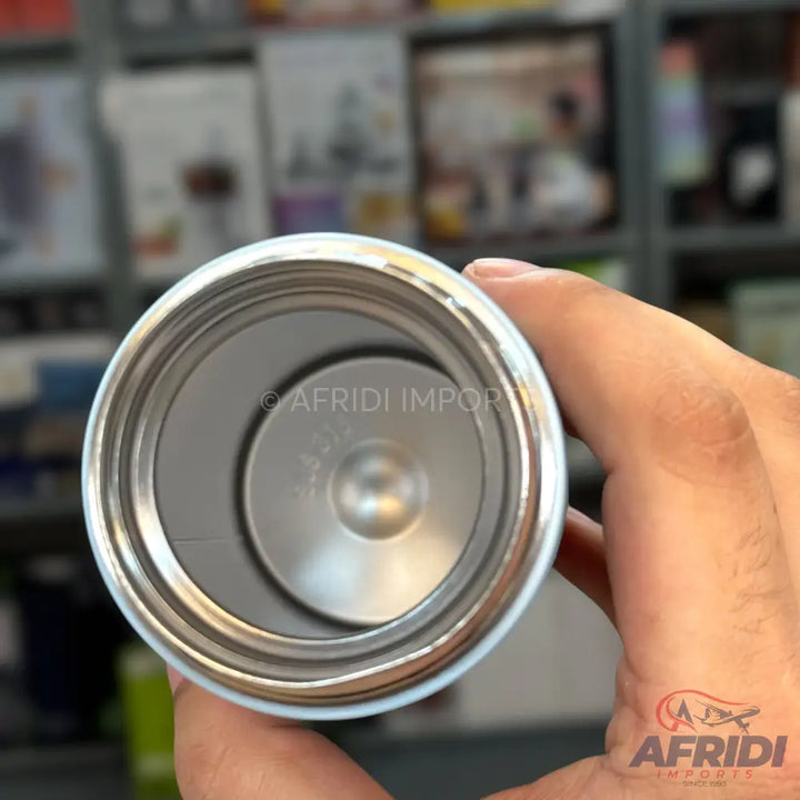 The interior of a stainless steel, double-walled insulated bottle or tumbler, showing a smooth, reflective surface and a circular indentation at the bottom.