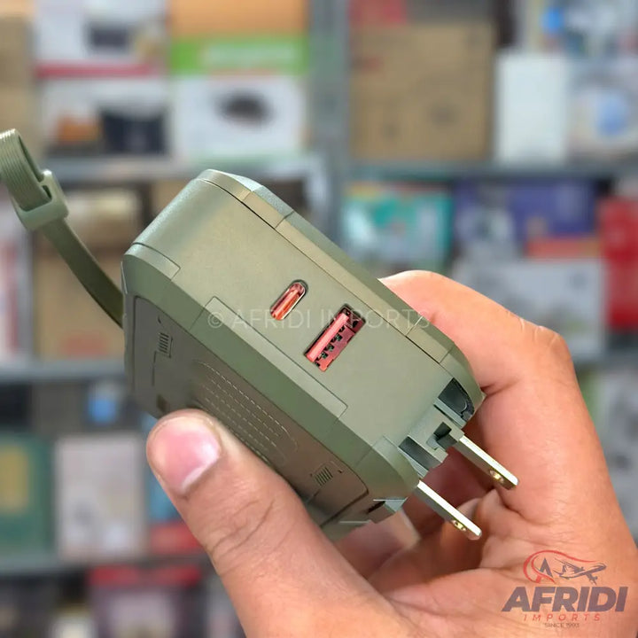 Olive green multi-port wall charger with two USB-C and one USB-A output, featuring foldable US-style prongs.