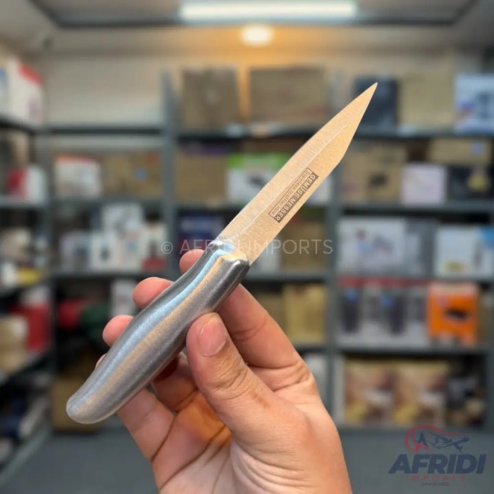 A utility knife with a full tang and an ergonomic metal handle.