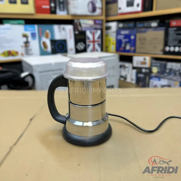 Stainless steel electric coffee maker with a black handle and base.