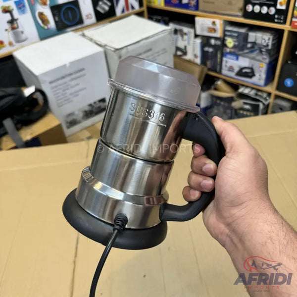 Stainless steel electric kettle with a black handle and base.