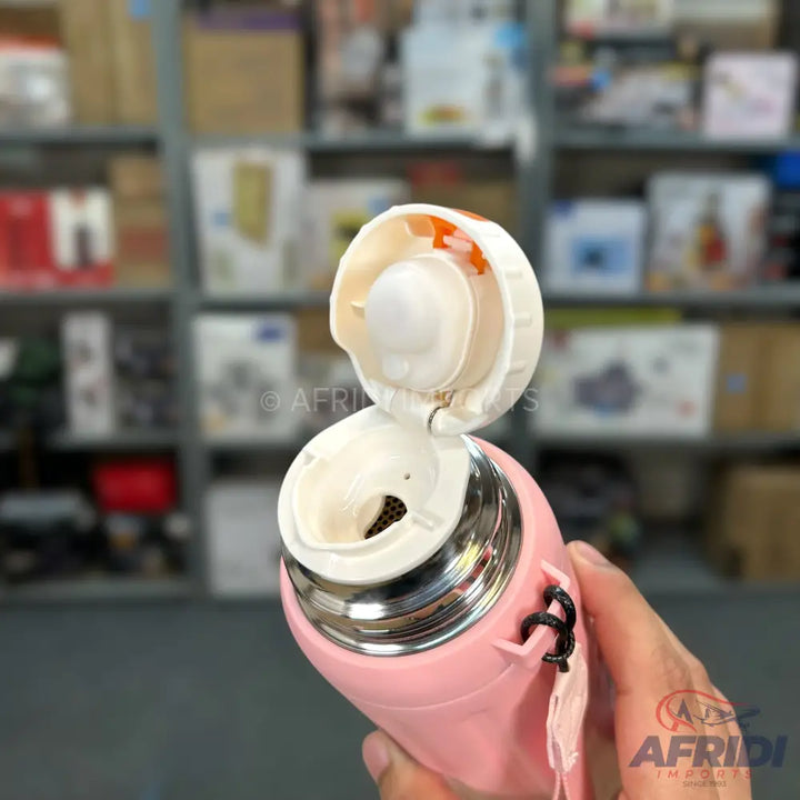 Pink thermal water bottle with an open white lid and a mesh filter.