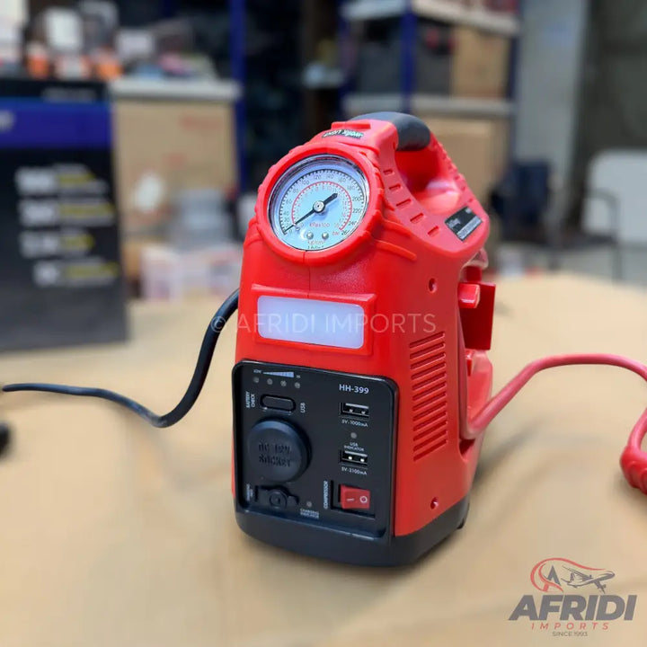 Red portable jump starter with an air compressor and power bank features.