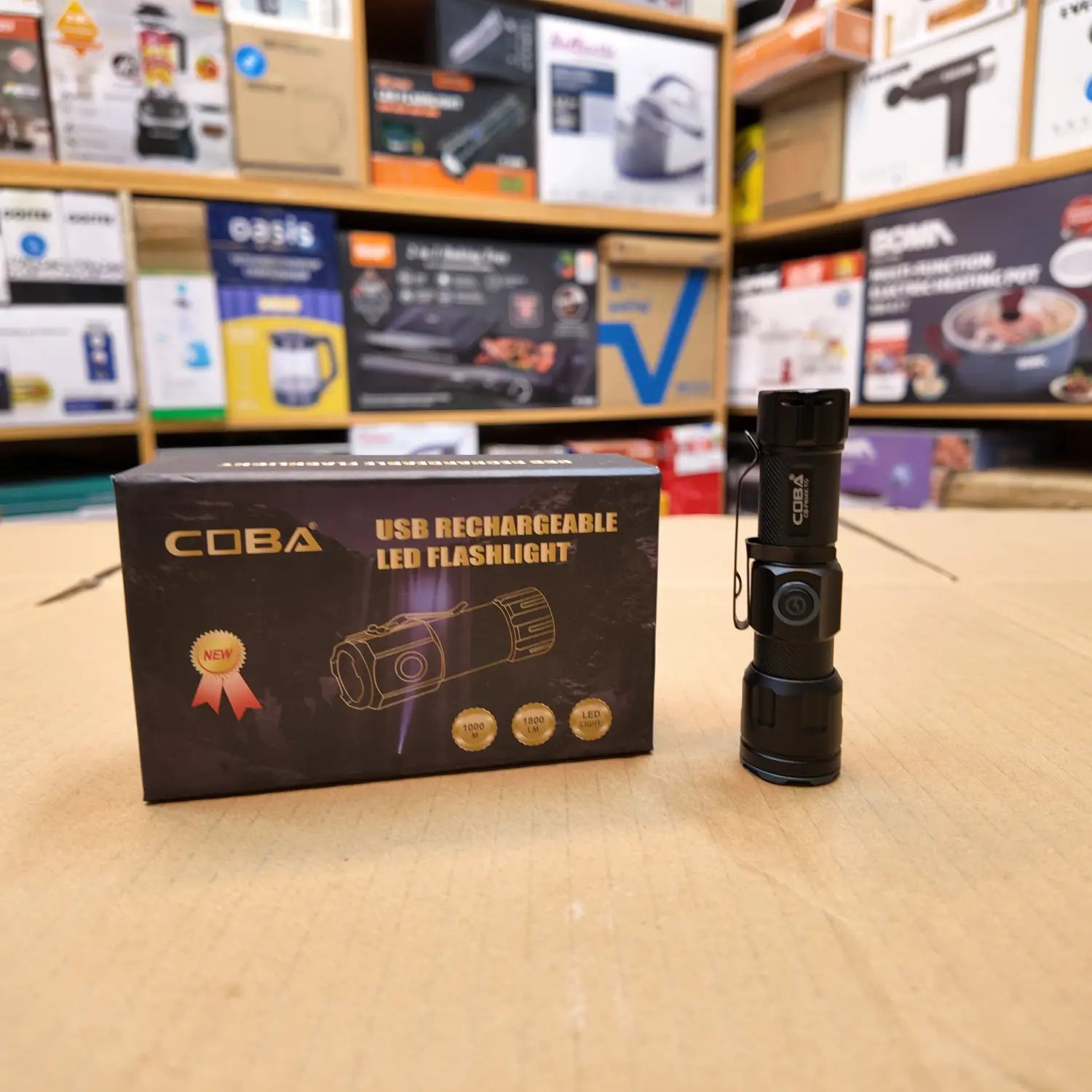 Black Coba Mini rechargeable LED flashlight with packaging, compact and portable design