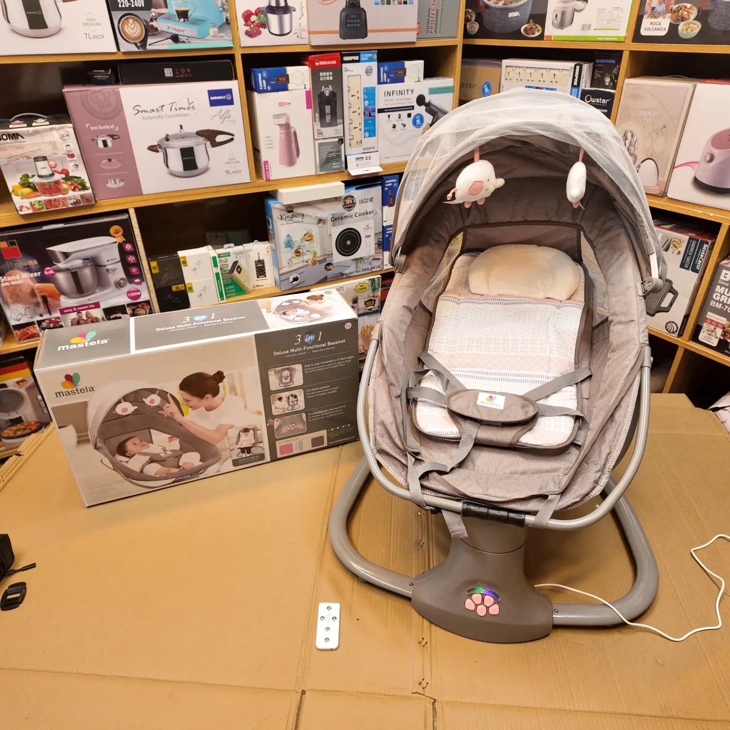 Gray infant swing and bouncer with canopy and mobile from Imported Mastela Electric Baby Swing