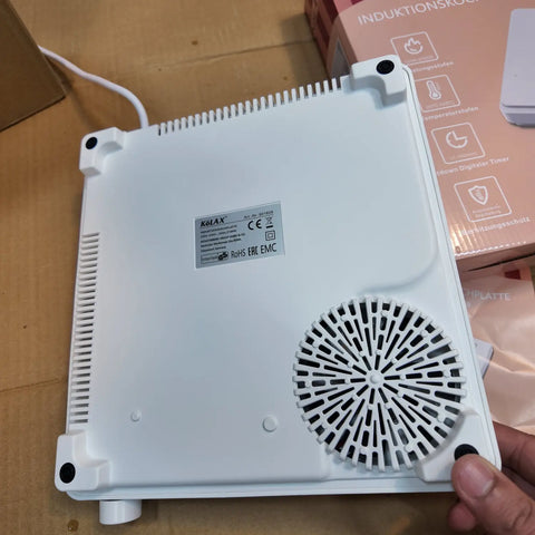 White portable Kolax induction cooker with cooling fan and product label, imported from German Lot