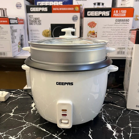 White electric rice cooker with steamer insert and glass lid from Geepas with warranty