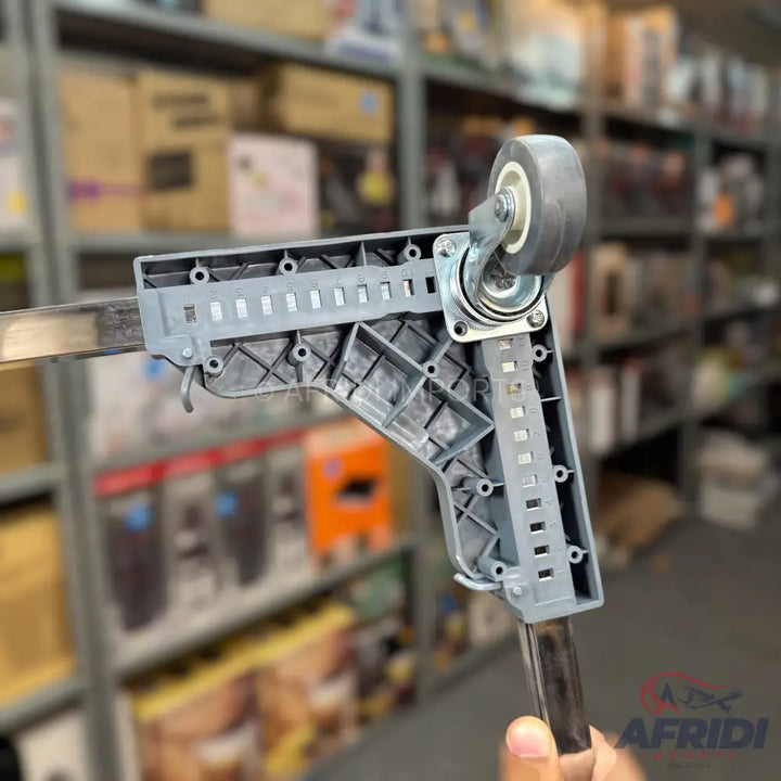 Adjustable gray plastic caster wheel bracket for a metal rod.
