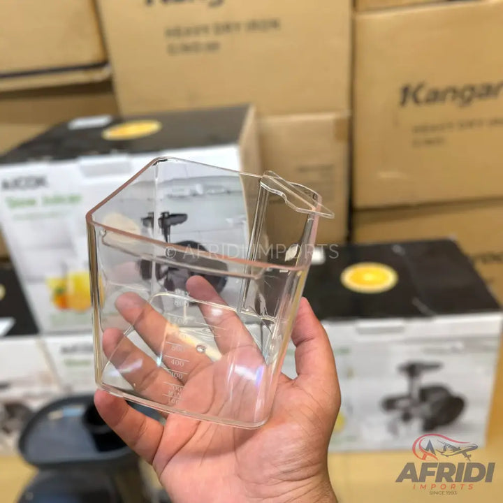 Clear plastic measuring cup with a handle and spout.