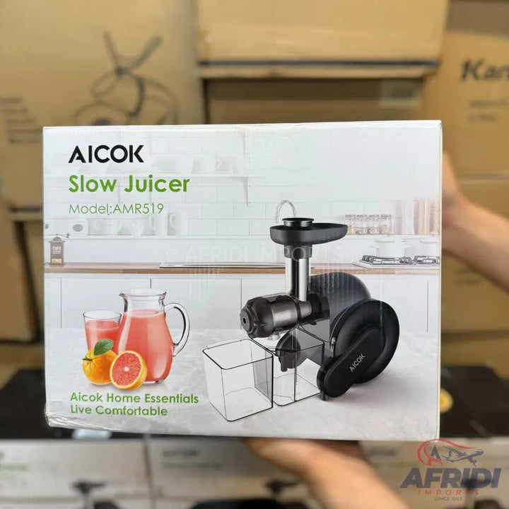Aicok Slow Juicer, Model AMR519, with a pitcher of juice and citrus fruits on the box.
