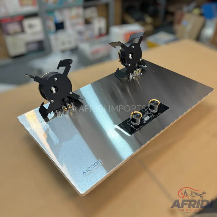 Stainless steel two-burner gas cooktop with control knobs.