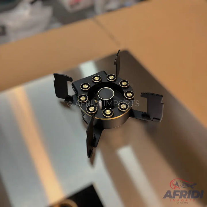 Black and gold adjustable oil filter wrench.