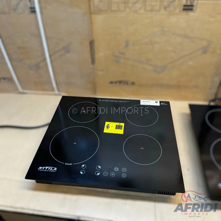 Four-burner black induction cooktop.