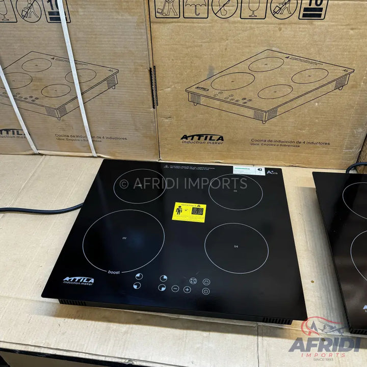 Black four-burner induction cooktop.