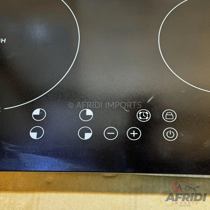 Black two-burner induction cooktop with touch controls.