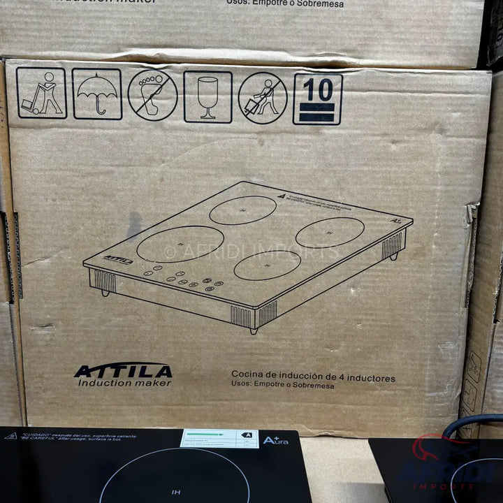 Cardboard box featuring a line drawing of a four-burner induction cooktop.