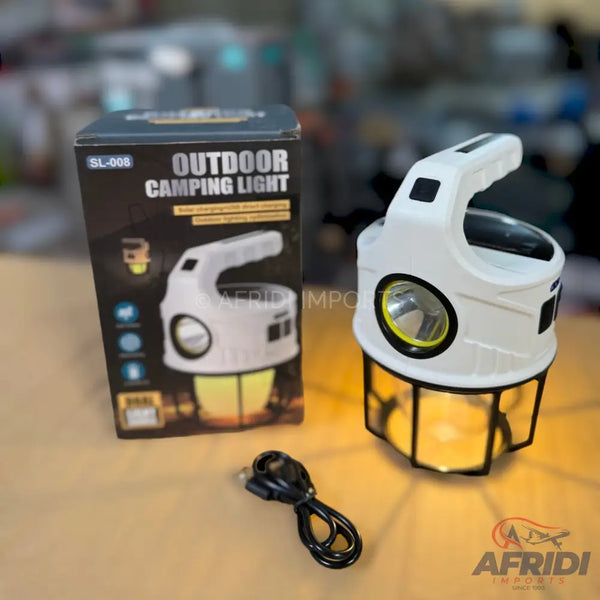 White multi-function outdoor camping lantern with a top handle and a base that emits a warm yellow light.