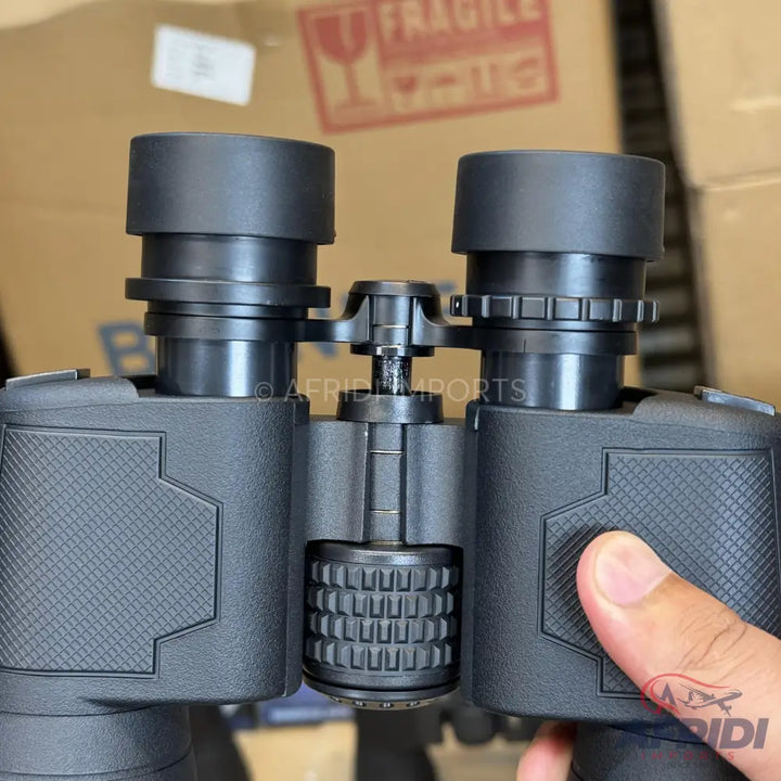 Black binoculars with textured grip and adjustable eyepieces.