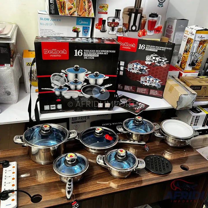 A 16-piece stainless steel cookware set with blue-tinted glass lids.