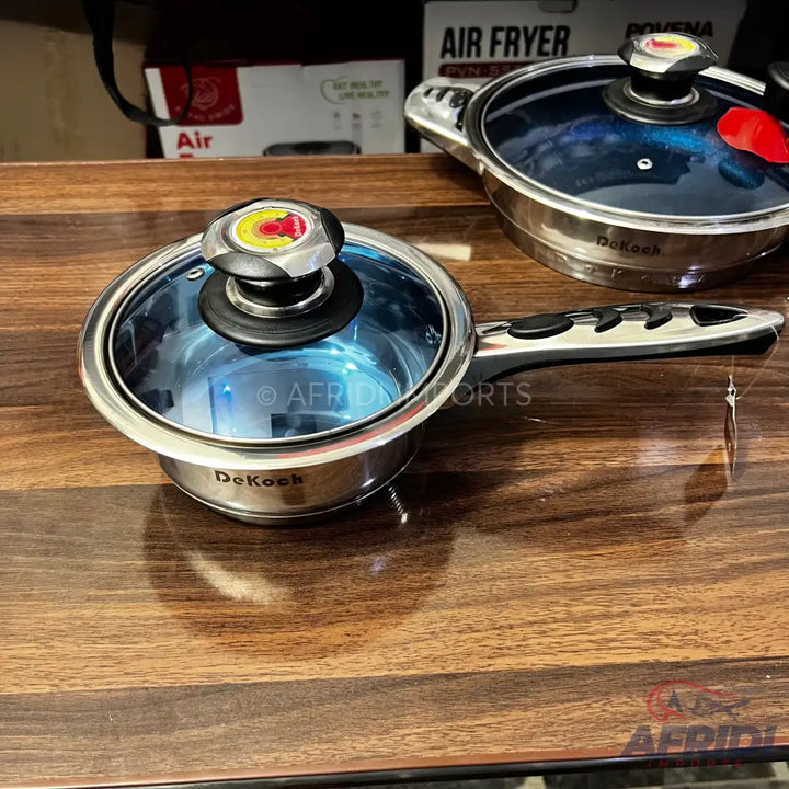 A stainless steel saucepan with a glass lid and an ergonomic handle.