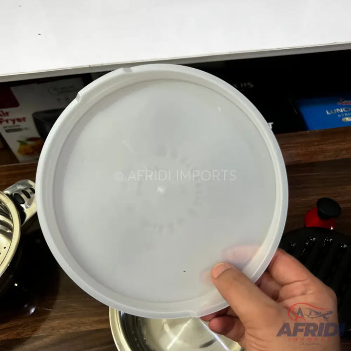 Translucent round plastic lid with a raised rim.