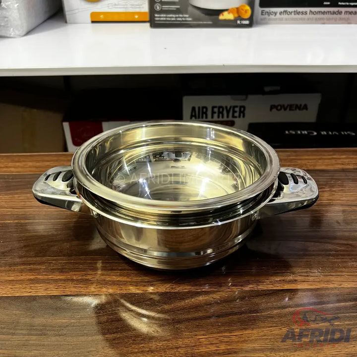 Shiny stainless steel insulated food warmer with side handles.
