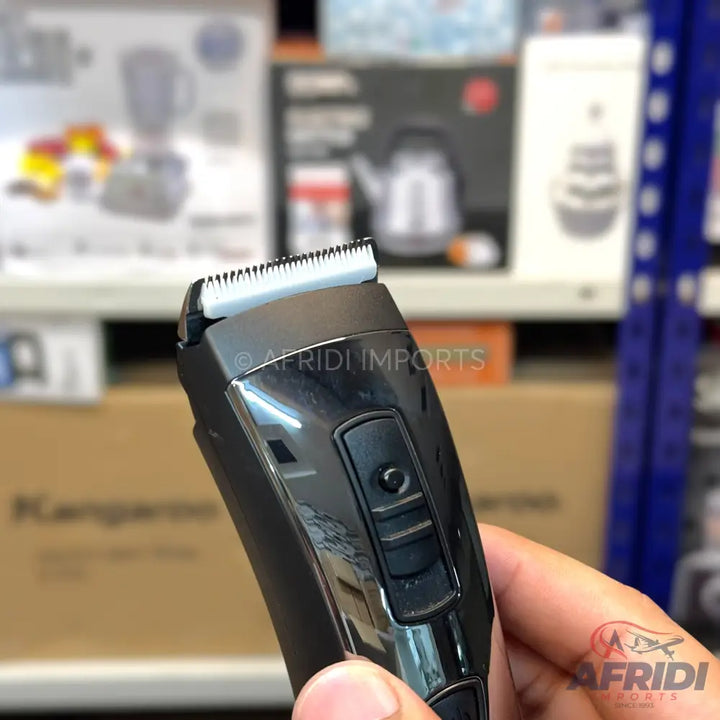 A black electric hair trimmer with a silver blade and an adjustable setting switch.