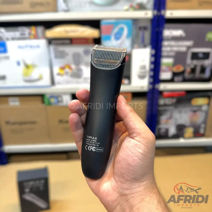 A black hair clipper or trimmer with a visible metal blade.