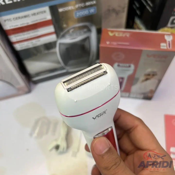 White and red electric shaver for women.